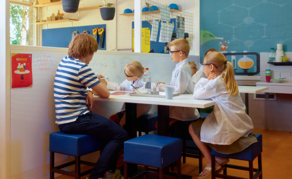 students using a whiteboard in their school lesson